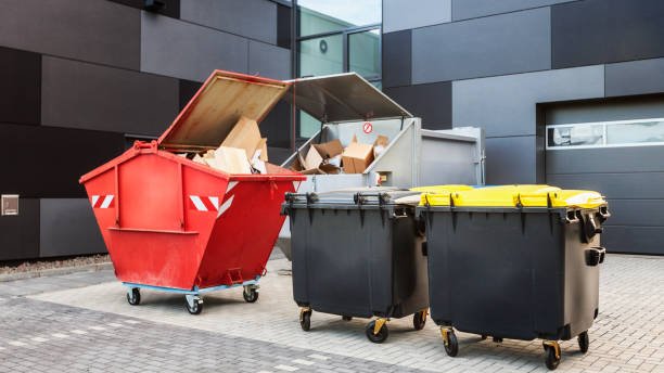 red dumpster, recycle waste and garbage bins near new office building