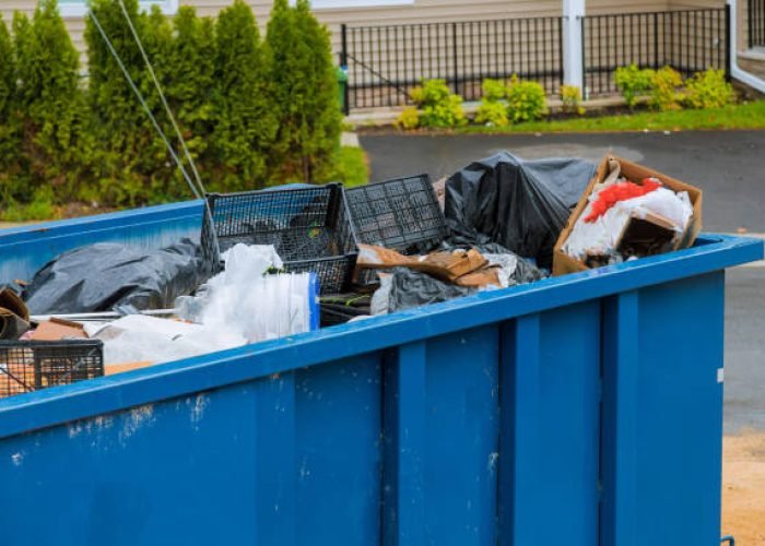 construction trash dumpsters on metal container, house renovation.